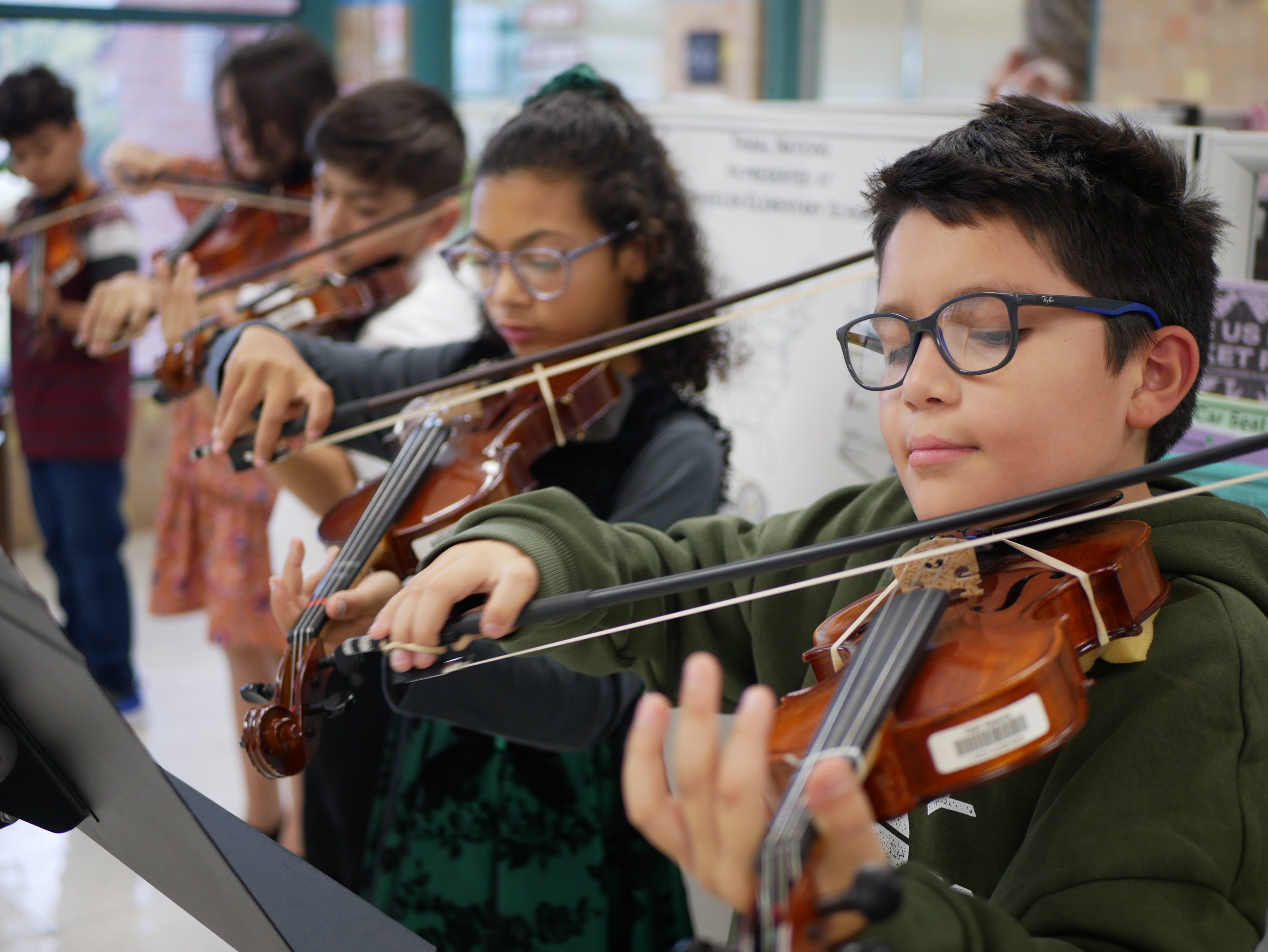 The beginning orchestra class performs for parents and guests at Wheeler Elementary in Tucson