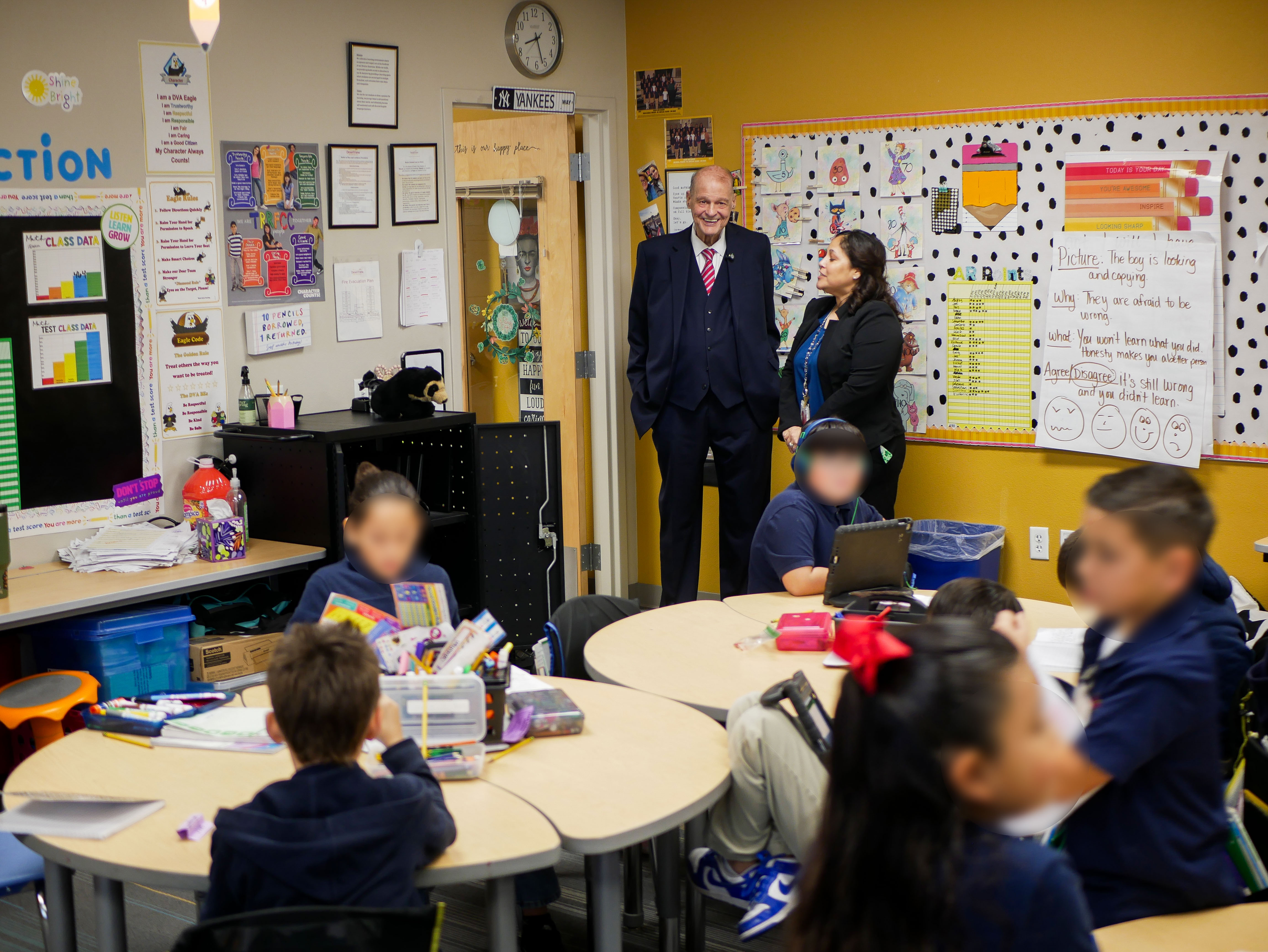 Superintendent Horn watches the busy activity of students at Desert View Academy Charter School in Yuma