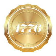 A golden seal with 1776 spelled out on it 